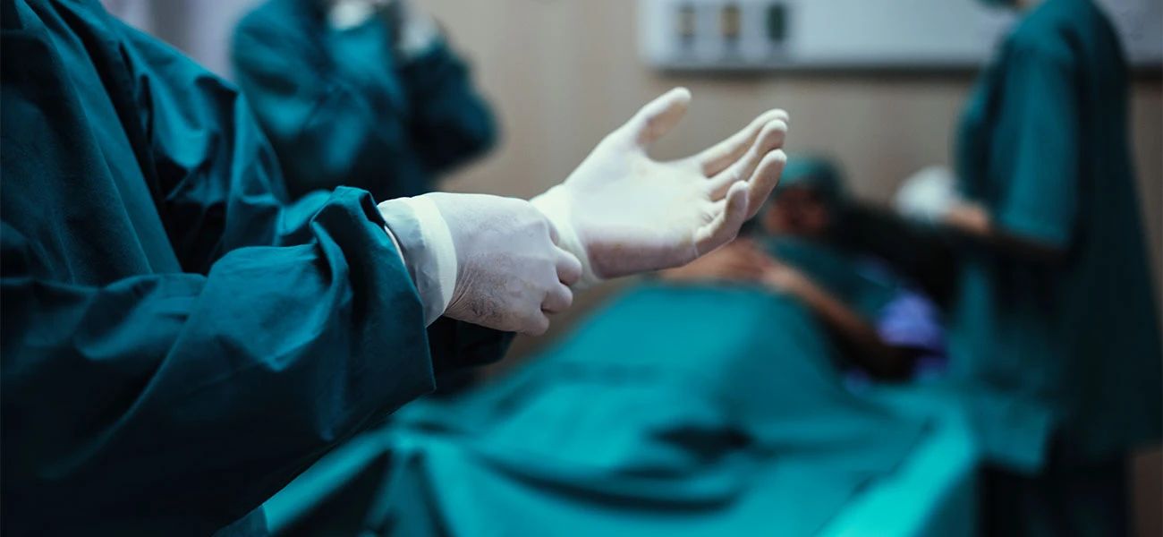 Surgical team preparing for abdominal wall hernia repair